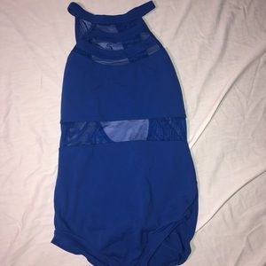 Blue high neck leotard with cut out mesh stripes.
